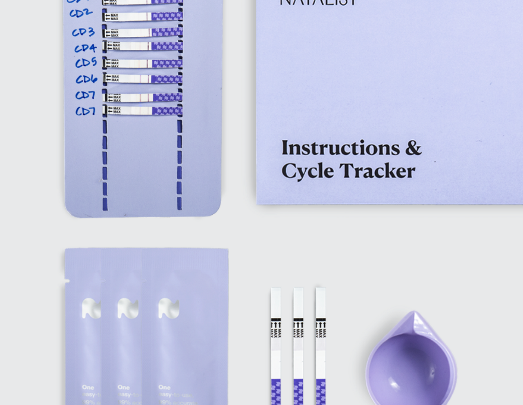 Natalist ovulation strips package contents including urine cup, cycle tracker, test strips, and instructions